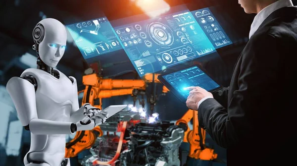 Cybernated industry robot and human worker working together in future factory . Concept of artificial intelligence for industrial revolution and automation manufacturing process .