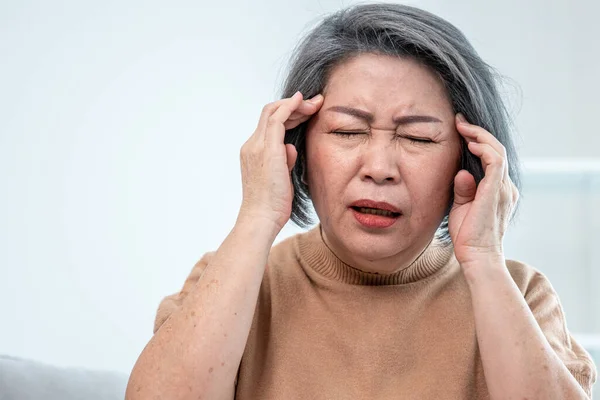 Agonizing Senior Woman Headache Compress Her Temple Both Hands Her — Stockfoto