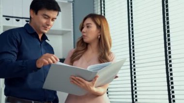 Concept of experienced and competent coworker, employer, supervisor giving advice to a young asian female office worker. Teamwork between coworkers, leadership company.