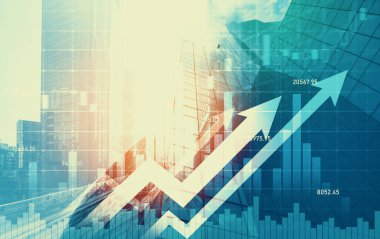 As background for a financial or business concept, digital screen and financial graphs overlap on a picture of modernistic cityscape, skyscrabbers.