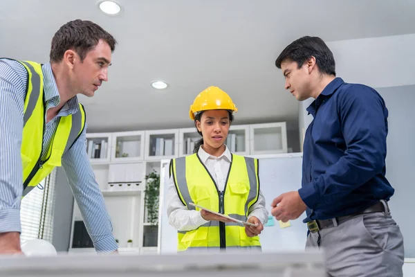 Team Competent Engineers Wearing Safety Equipment Working Blueprints Tablet While — Stockfoto