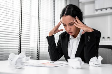 A competent female employee who has become completely exhausted as a result of overburdened work. Concept of unhealthy life as an office worker, office syndrome, effect from overwork.
