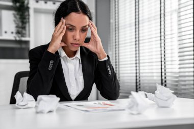 A competent female employee who has become completely exhausted as a result of overburdened work. Concept of unhealthy life as an office worker, office syndrome, effect from overwork.