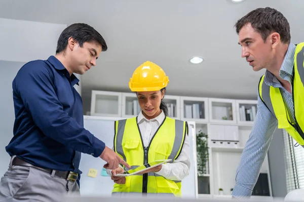 Team Competent Engineers Wearing Safety Equipment Working Blueprints Tablet While — Stok fotoğraf